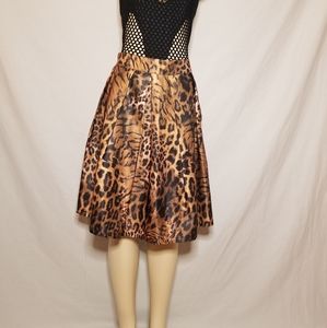 Animal print brown skirt with pastel pink.